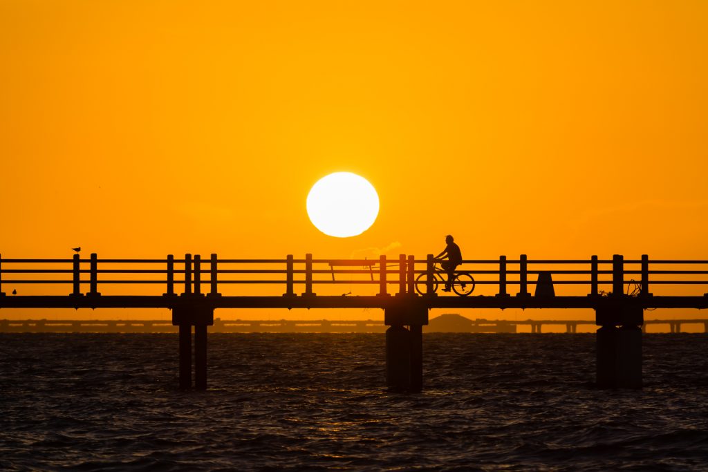Biker Silhouette at Sunrise on Bay Pier, Fort Desoto, Tierra Verde, Florida