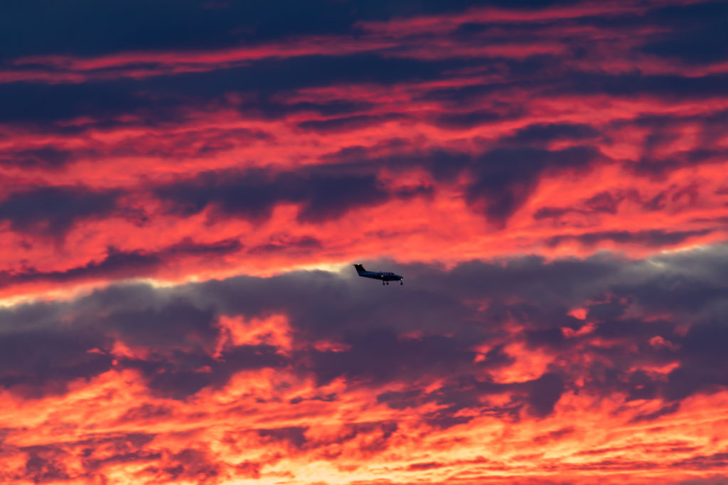 Fiery Sunset and Plane